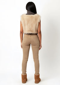 Thumbnail for Person wearing a Cropped faux fur vest with shawl collar and ribbed knit base.