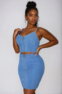 Thumbnail for Woman wearing a blue denim two-piece outfit on a white background