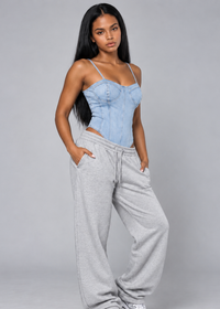 Thumbnail for Lady wearing denim bodysuit with light grey joggers.